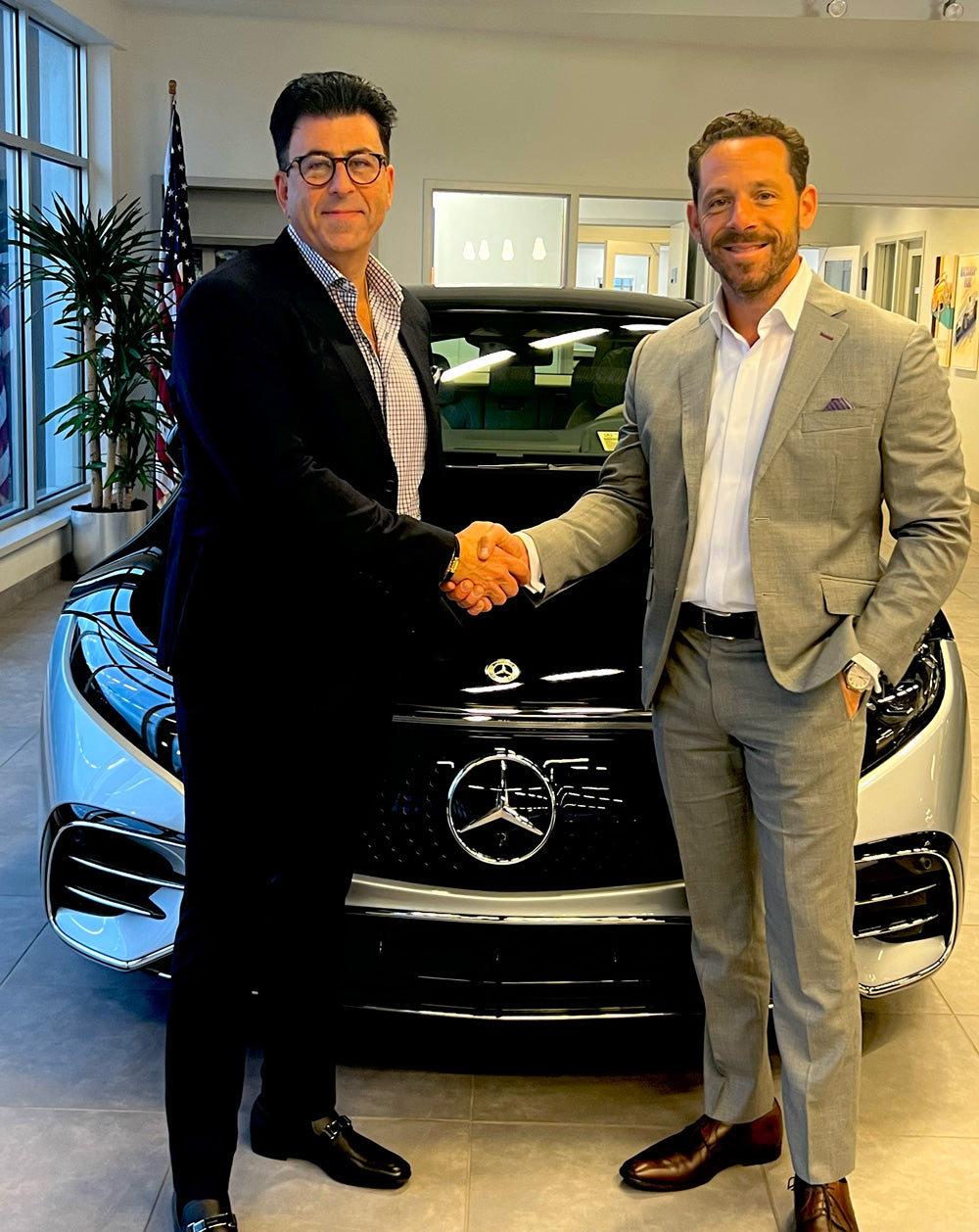 joseph albershtat and michael leikin in front of a mercedes-benz